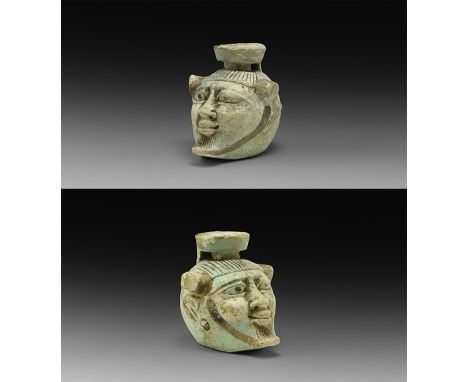 Late Period, 664-332 BC. A pale blue glazed composition ink pot formed as a bearded male head with lateral horns to the brow,