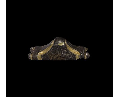 6th century AD. A parcel-gilt silver sword pommel cap of Bifrons-Gilton type, rectangular in plan with two pierced lugs and s