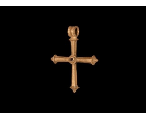 5th-7th century AD. A hollow-formed gold cruciform pendant formed as four hollow hexagonal-section expanding arms each with a