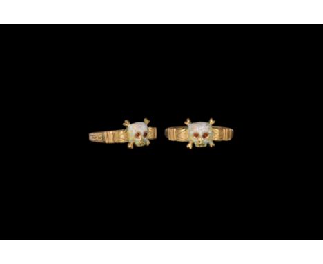 Late 17th century AD. A gold ring comprising a D-section hoop with lateral panels of niello-filled scrolled-tendril ornament,