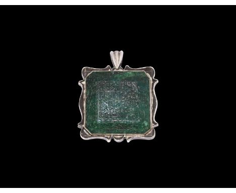 19th century AD. A large square emerald with panel of calligraphic prayer text surrounded by faceted edges with more text, in