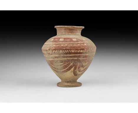Mid 3rd millennium BC. A ceramic jar with broad discoid foot, conical body, broad domed shoulder, broad neck with rolled rim;