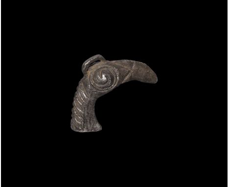 8th-9th century AD. A silver bird-head pendant comprising a D-section neck and curved beak with hollow to the inner face, her