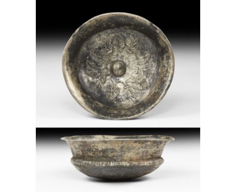 6th-4th century BC. A silver bowl with flared rim; shoulder decorated with elongated ovules; to the inside repoussé decoratio