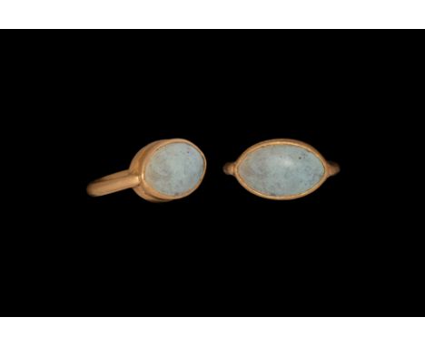 1st century BC-1st century AD. A gold finger ring comprising a round-section D-shaped hoop, gusseted scaphoid bezel with inse