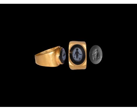 1st-2nd century AD. A flat-section gold hoop with perpendicular shoulder, raised collet and inset nicolo intaglio of Mercury 