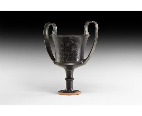 South Italian, 5th-4th century BC. A black-glaze kantharos with bell-shaped body, sharply carinated to the bottom and flared 