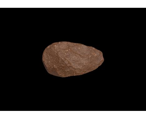 1,000 000-300,000 years BP. A substantial knapped stone handaxe with broad, rounded cutting edge.  1.05 kg, 20cm (8"). Proper