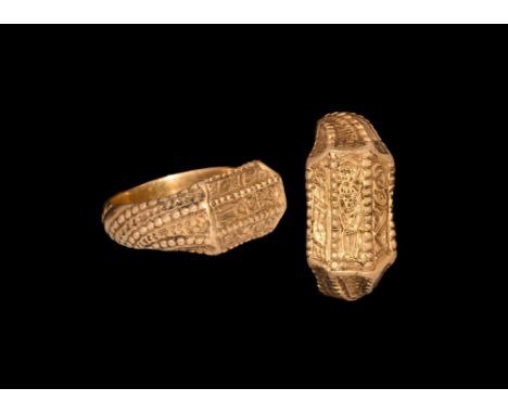 14th-15th century AD. A gold iconographic ring with facetted bezel of three panels depicting a haloed figure, most likely the