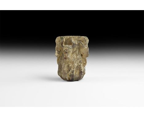 5th-3rd century BC. A carved agate kohl pot or cosmetics phial formed as two addorsed rams' foreparts and two bulls', the rim