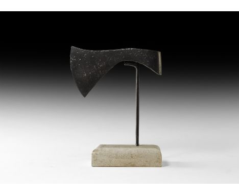 5th-8th century AD. A socketted triangular-section iron francisca axehead with broad curved cutting edge and elliptical socke