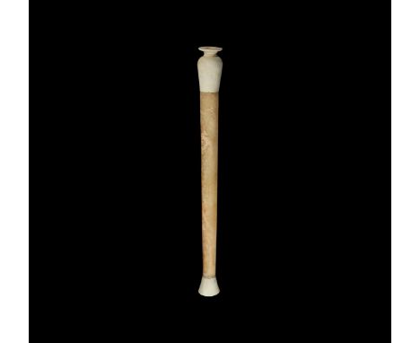 Early 1st millennium BC. A staff comprising a hollow alabaster shaft with ceramic terminals; lower end conical in shape with 