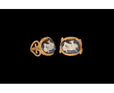 2nd century AD. A gold ring comprising a beaded wire hoop expanding to lyre-shaped openwork shoulders, discoid bezel with cel
