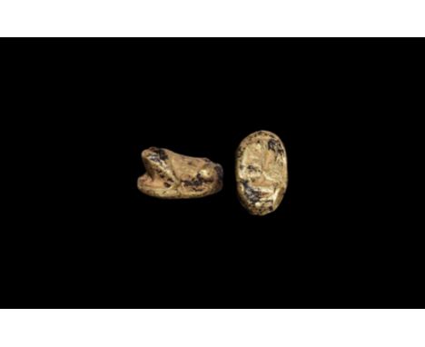 New Kingdom, XVIII Dynasty, 1470-1330 BC. A gold amulet of a frog with detailing to the body; the underside engraved with hie
