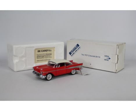 Franklin Mint - A boxed 1:24 scale 1957 Chevrolet Bel Air by Franklin Mint. The model appears to be in Mint condition with sw