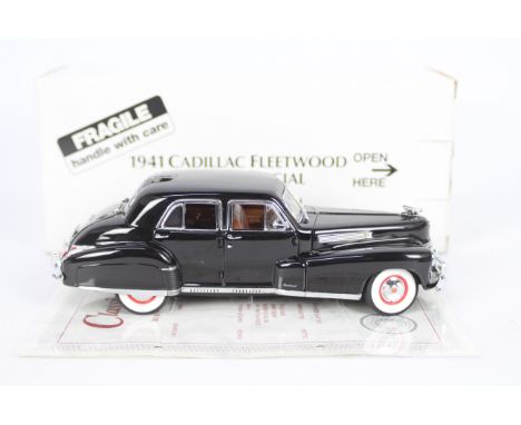 Danbury Mint - A boxed 1:24 scale 1941 Cadillac Fleetwood Series 60 Special by Danbury Mint. The model appears to be in Mint 