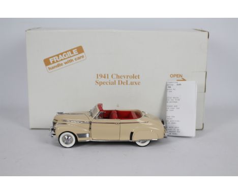 Danbury Mint - A boxed 1:24 scale 1941 Chevrolet Special Deluxe by Danbury Mint. The model appears to be in Very Near Mint co