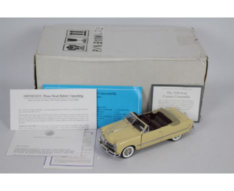 Franklin Mint - A boxed 1:24 scale 1949 Ford Custom Convertible by Franklin Mint. The model appears to be in Mint condition a