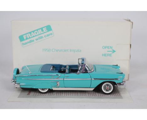 Danbury Mint - A boxed 1:24 scale diecast 1958 Chevrolet Impala Convertible by Danbury Mint. The model appears to be in Very 