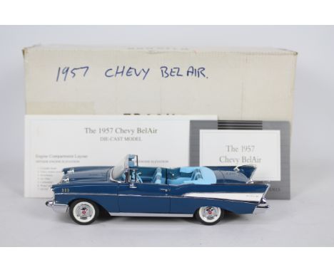 Franklin Mint - A boxed 1:24 scale 1957 Chevy Bel-Air by Franklin Mint. The model appears to be in Excellent condition overal