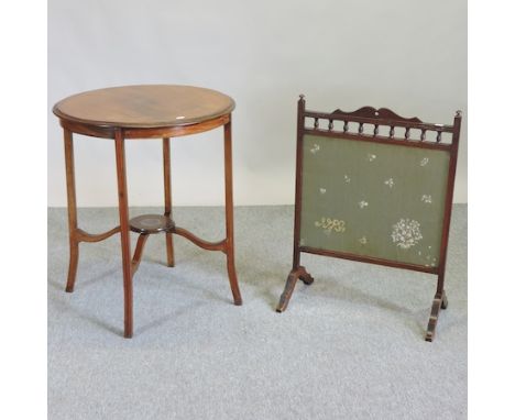 A mahogany and inlaid two tier occasional table, 59cm, together with an oak and embroidered fire screen, 54cm