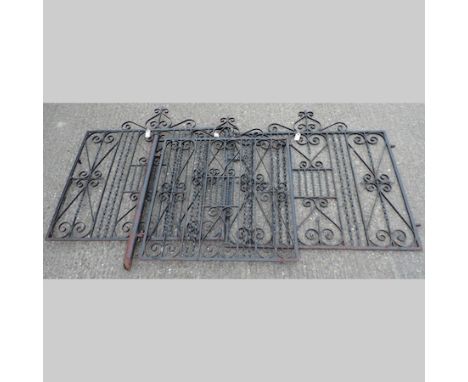 A pair of wrought iron gates, together with a matching hand gate, 336cm overall