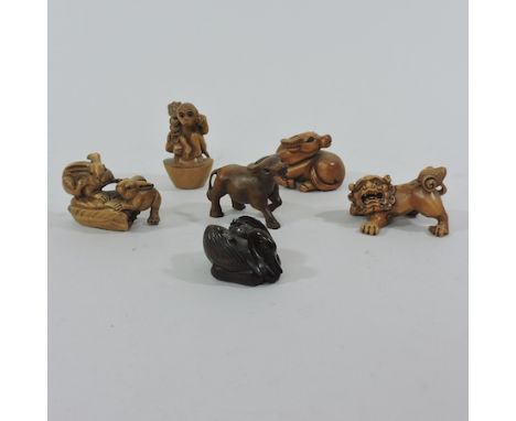 A Japanese carved rabbit netsuke, together with five others, tallest 6cm