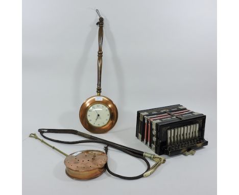 A copper warming pan, inset with a clock, together with a copper chestnut roaster and a leather hunting whip