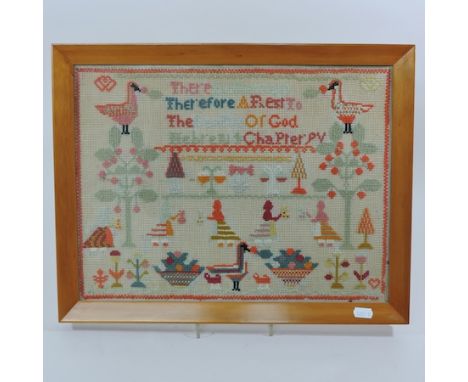 An early 20th century woolwork sampler, 31 x 42cm