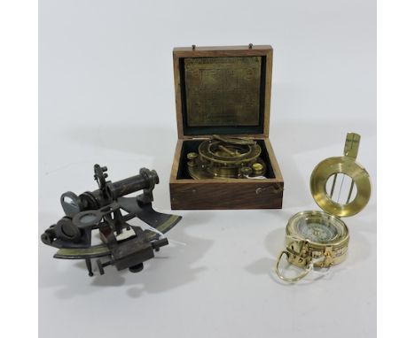 A sundial compass, boxed, 13cm, together with a small sextant and a marching compass