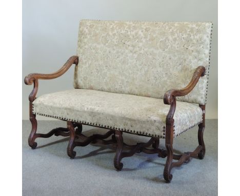 A 19th century Jacobean style walnut floral upholstered sofa, on carved legs, 142cm