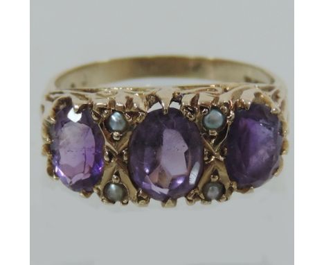 A Victorian 9 carat gold amethyst and seed pearl ring