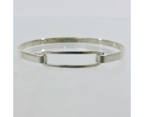 A Tiffany & Co. silver and 18 carat white gold bangle, dated 2003
