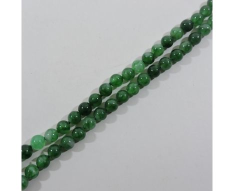 A jade coloured bead necklace