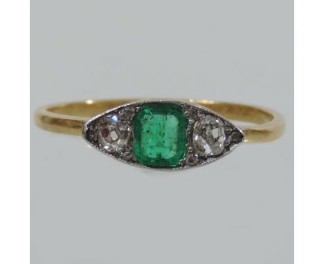 An Art Deco emerald and diamond three stone ring, of eliptical shape, bearing inscription, Martin Ann