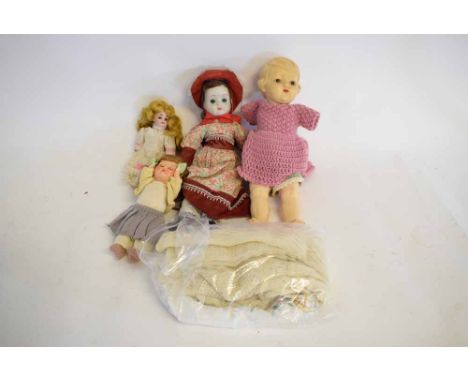 Mixed Lot: four vintage dolls of varying sizes with glass eyes 