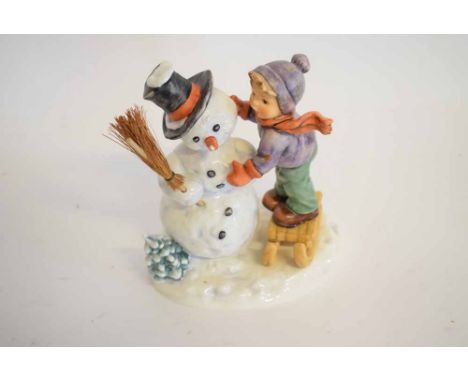 Hummel Goebel figure entitled "Making new friends", 125 year anniversary edition of a young girl making a snowman, 16cms tall
