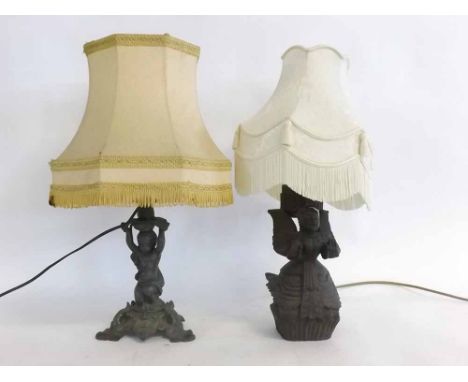 Eastern carved kneeling lamp modelled as a figure with wings, together with a cream shade, plus a further lamp with putti hol