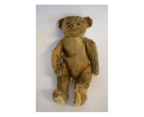 Vintage mohair and straw filled teddy bear with glass eyes and stitched features (a/f), 30cms tall 