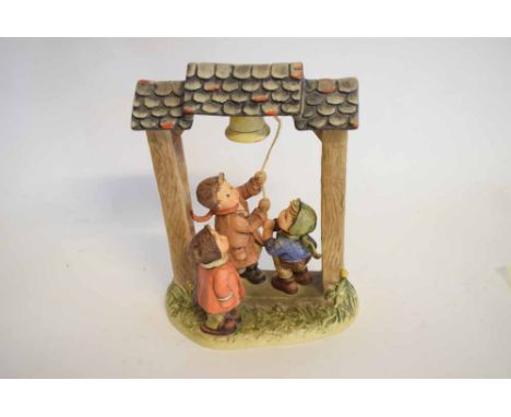 Hummel Goebel figure group entitled "Let's tell the World" of three children ringing a bell, 20cms wide x 27cms tall  