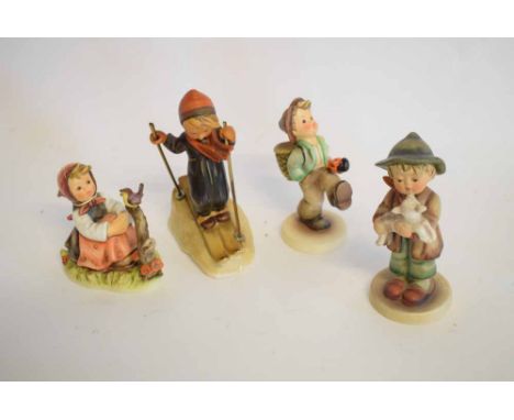 Four Hummel Goebel figures to include a boy skiing, a boy going for a stroll with a basket on his back, a young girl with a b