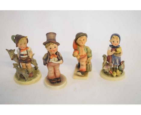 Four Hummel Goebel figures to include a young boy with a goat, a choirboy with a top hat, young boy with a Gladstone bag and 