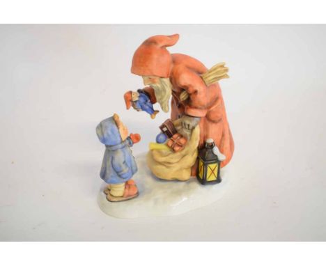 Hummel Goebel figure entitled "St Nicholas Day" of a child receiving a Christmas present, 18cms tall  