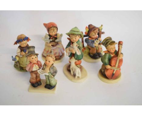 Group of six Hummel Goebel figures to include a young boy with his lambs, a choirboy, a young girl with flowers in her hair, 
