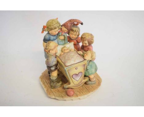 Hummel Goebel figure group, children gathered around a newborn in a crib, 20cms tall 