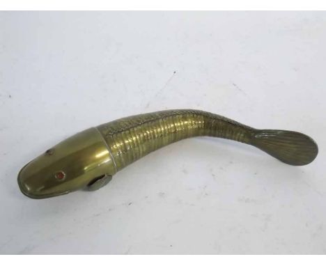 Good quality brass articulated fish with red enamel eyes, 30cms long  