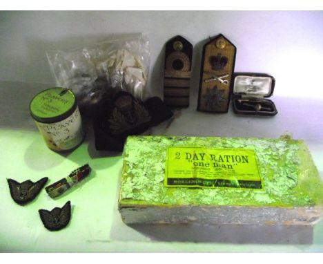A quantity of military uniform buttons, sections of uniform metallic ribbon, naval epaulettes, 20th century first aid field d