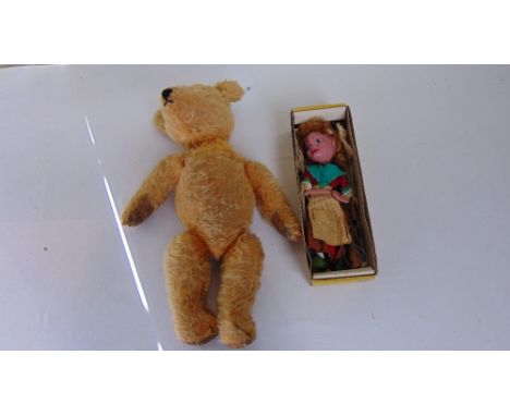 A standard Pelham Puppet together with a single vintage teddy bear