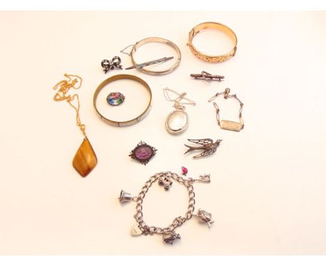 A sterling silver charm bracelet, suspended with five various charms, heart-shaped padlock clasp; a sterling silver hinged ba
