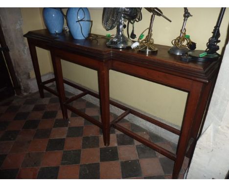 A 19th century mahogany breakfront side or hall table with moulded outline, raised on six square tapered supports, 95cm in le